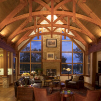 Furnished living room with curved rafters